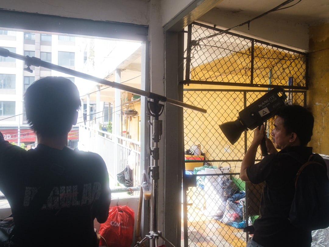 Photographer conducting a documentary interview with a local resident indoors